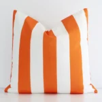 A premium outdoor orange striped cushion boasting a large size.
