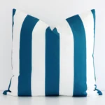 Front view of stripe large cushion. Crafted from a special outdoor material in a teal colour.