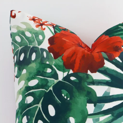 A detailed shot of this red floral cushion cover that has outdoor fabric and a square size.