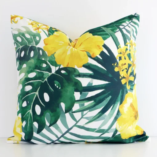 A graceful square yellow cushion with a floral style on durable outdoor fabric.