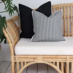 Imagine the striking contrast of solid black and black-striped outdoor sofa cushions adding a touch of elegance to your outdoor seating area.