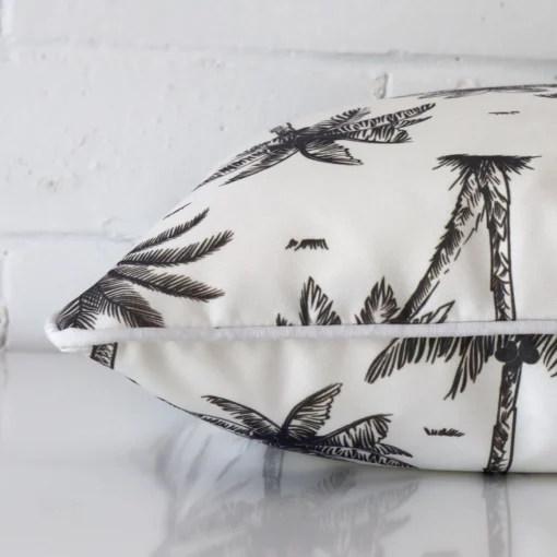 A side shot of an outdoor cushion cover. The angle shows the edge of the square shape and the black and white tone.