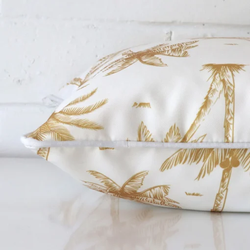 A square outdoor cushion positioned flat to show its seams. The mustard colour and design are visible as is the seam between the panels