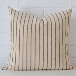 A bold striped designer cushion in a sleek large size.