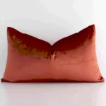 Stylish rust solid-coloured cushion cover constructed from velvet fabric and shown in a rectangle shape.