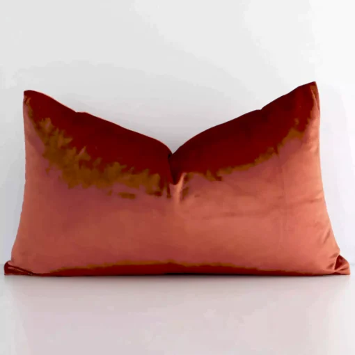 Stylish rust solid-coloured cushion cover constructed from velvet fabric and shown in a rectangle shape.