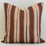 Sienna outdoor cushion with wide brown and tan vertical stripes.
