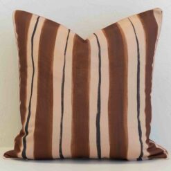 Sienna outdoor cushion with wide brown and tan vertical stripes.