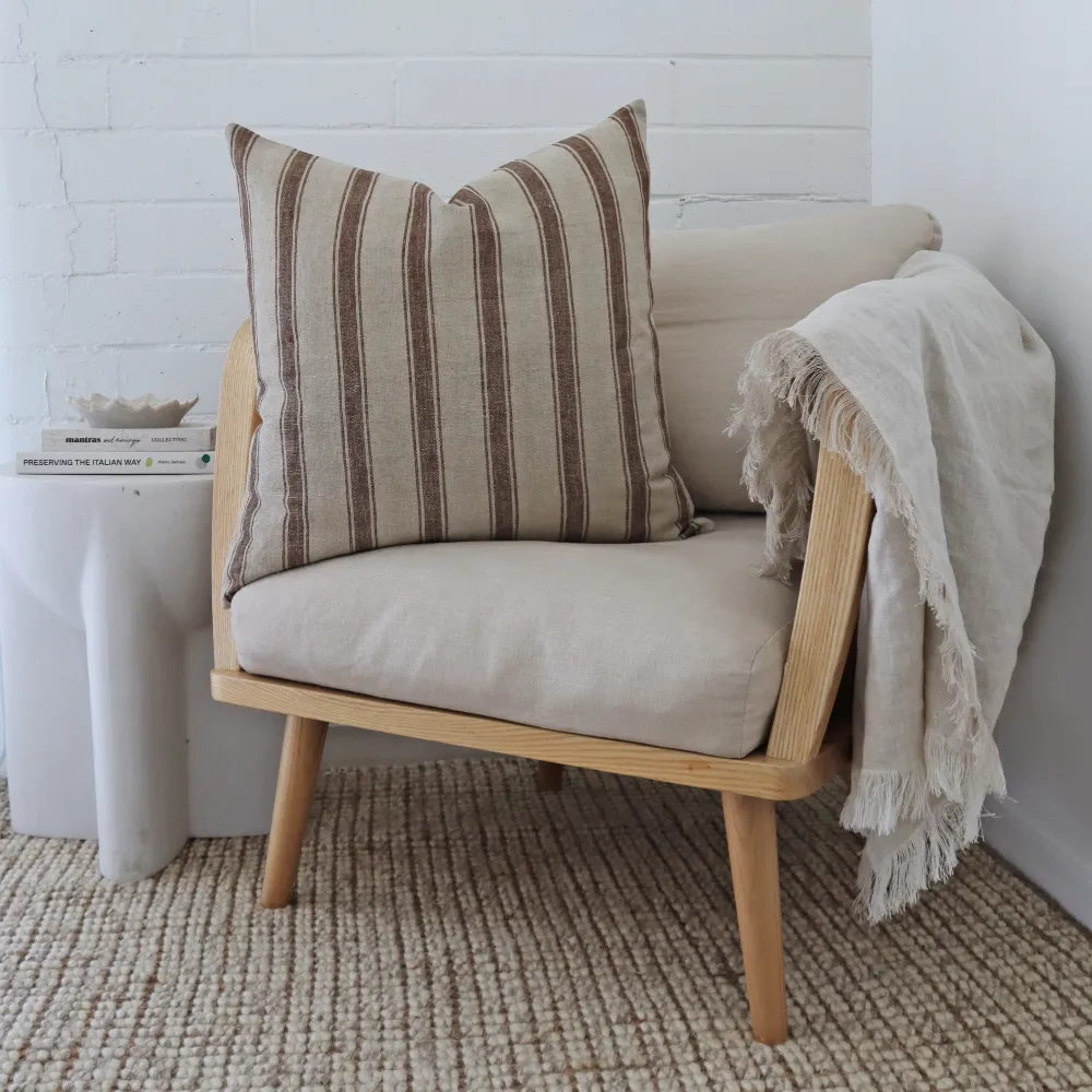 A single chair has been decorated with a large cushion.