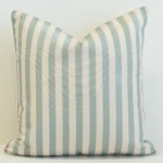 Stonebay seafoam striped outdoor cushion with vertical pale blue and white lines.