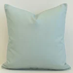 Stonebay seafoam outdoor cushion in plain light blue with white piping.