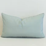Stonebay seafoam rectangular cushion in plain light blue with white piping.
