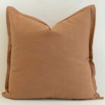 Tan linen cushion with warm earthy tone and soft textured finish.