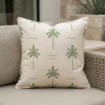 Tropica green palm tree cushion with repeating pattern on outdoor seat.