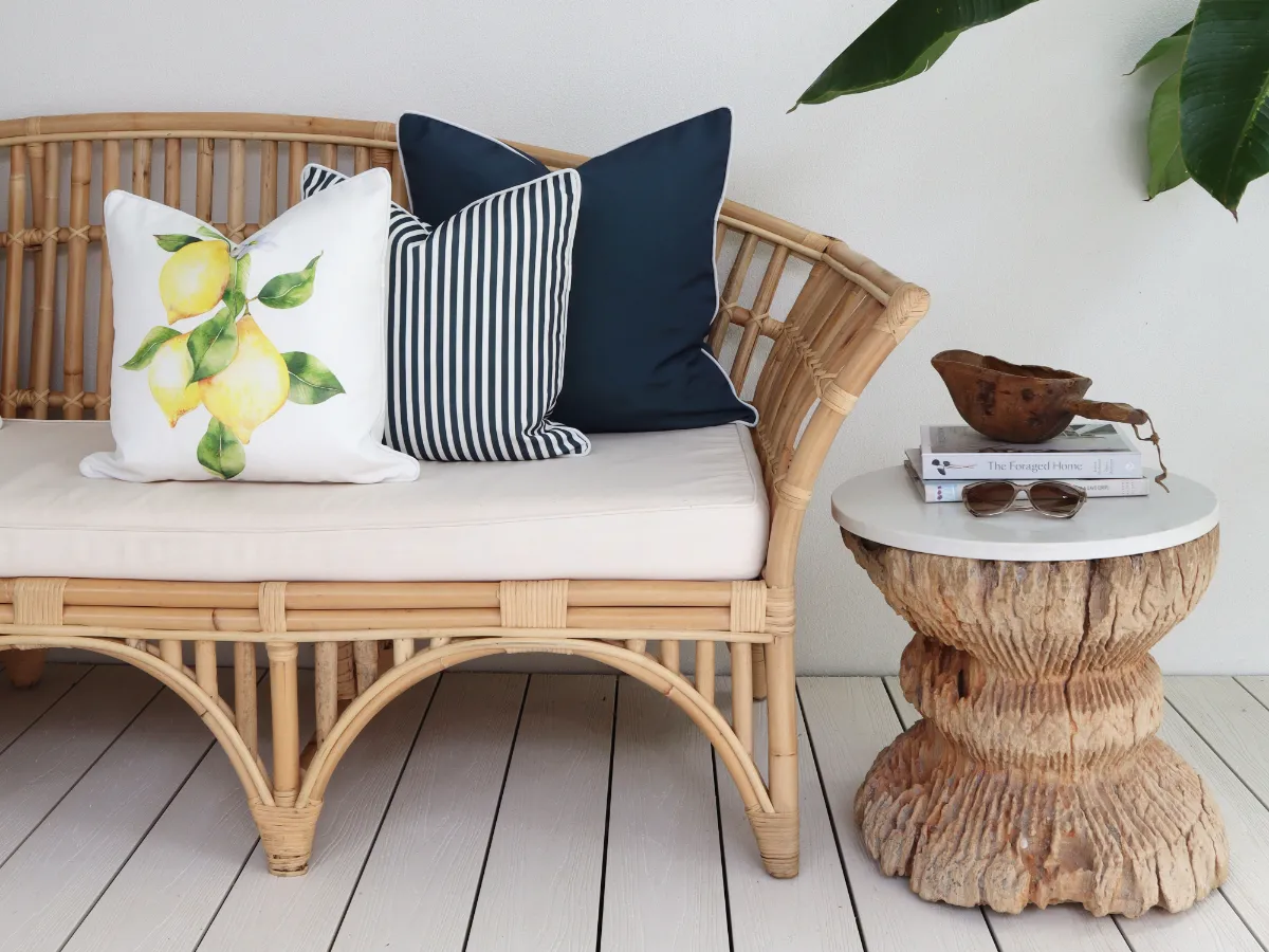 A vibrant set of outdoor cushions arranged using a block and a stripe and a feature design recipe.